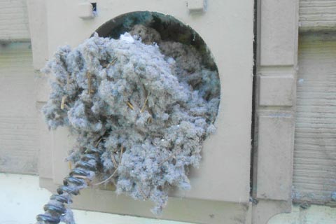 Interior commercial building vent cleaned of lint 2